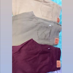 3 pair Levi jeans , purple , olive and khaki.